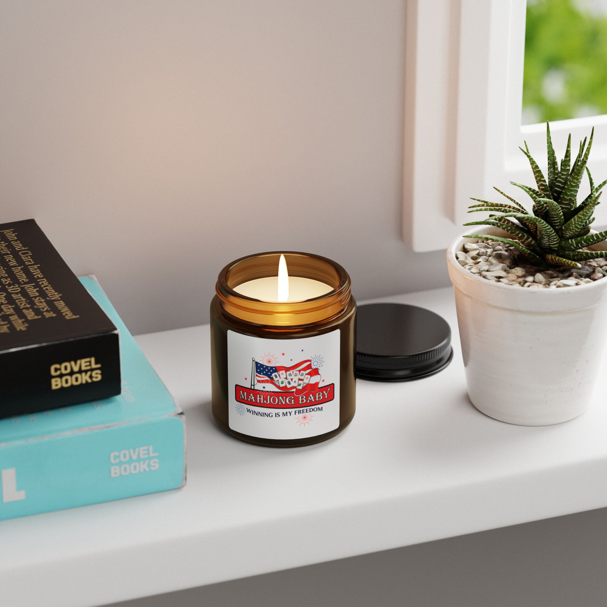 Mahjong Baby patriotic soy candle in amber jar on shelf, Winning Is My Freedom candle design, decorative home fragrance